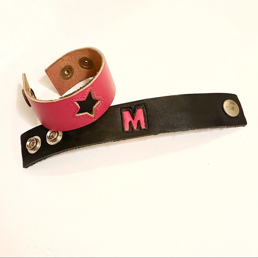 2 pink black leather band bracelets